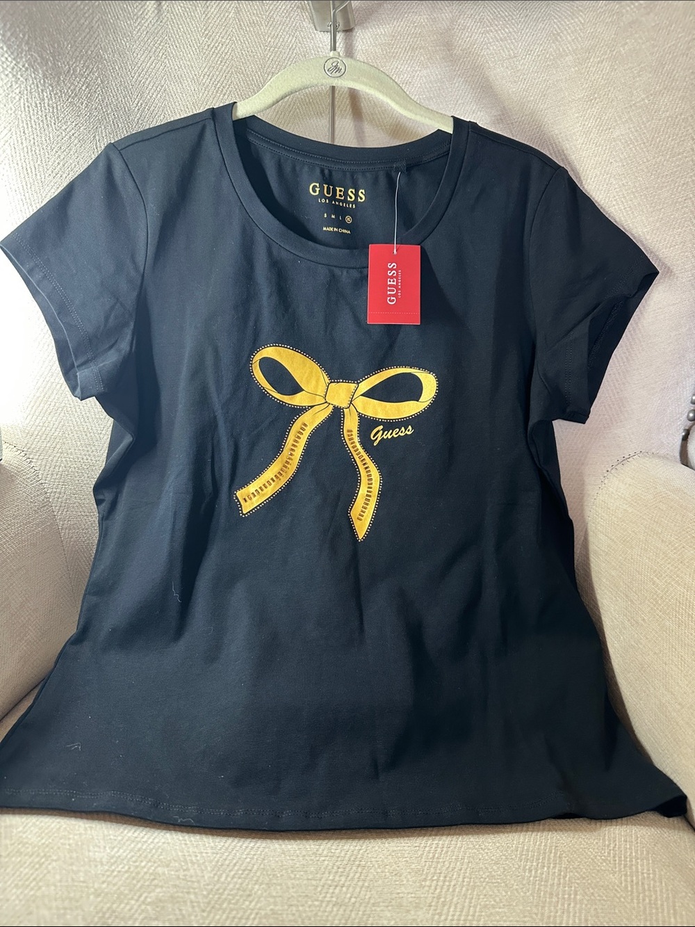 GUESS Black Short-Sleeve Tee with Yellow Bow Graphic PTP 19”